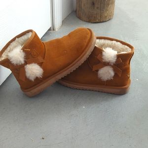 Kookaburra ugh camel cognac colored fur boots with bows